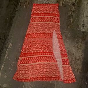 A full skirt with a slit. Red and tan. Very thin